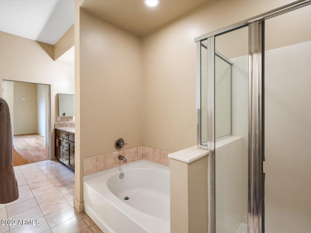 bathroom with vanity, separate shower and tub, and hardwood / wood-style flooring