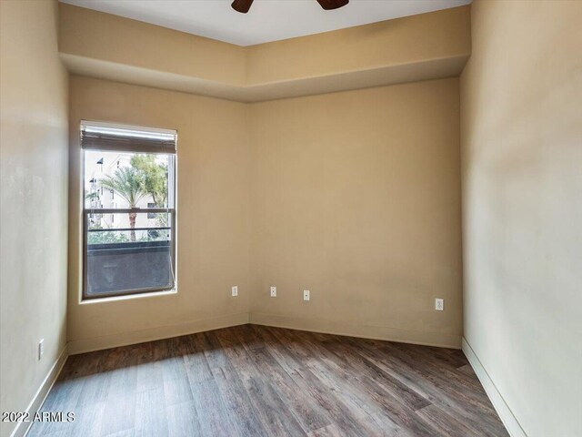 empty room with wood-type flooring and ceiling fan