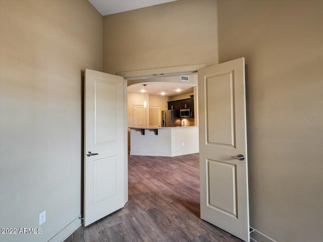 empty room with hardwood / wood-style flooring