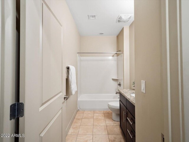 full bathroom with tile patterned floors, vanity, tub / shower combination, and toilet