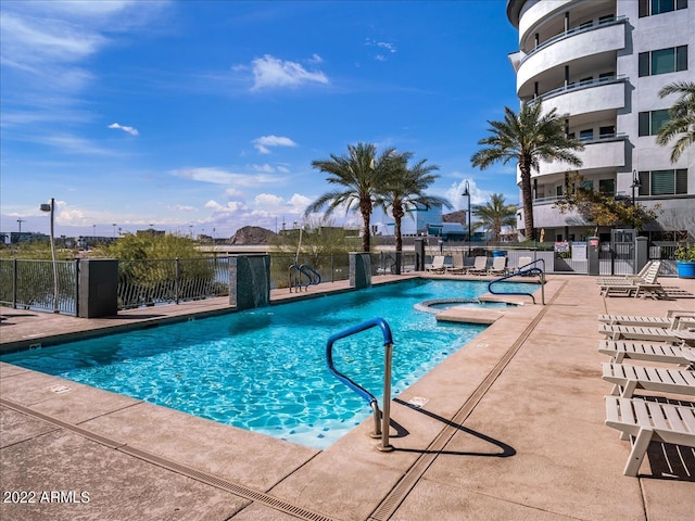 view of swimming pool featuring pool water feature