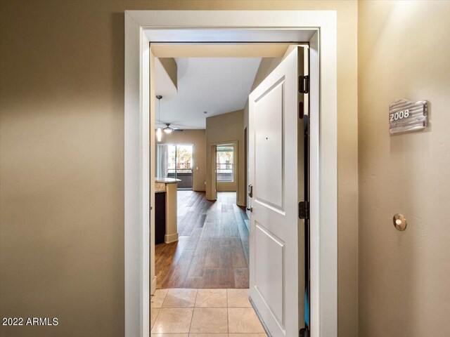 corridor with light tile patterned floors