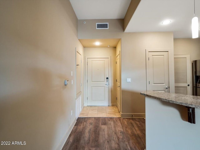 doorway to outside featuring light wood-type flooring