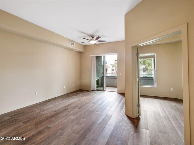 unfurnished bedroom with hardwood / wood-style floors and ensuite bathroom