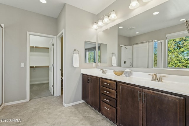 bathroom with vanity and walk in shower