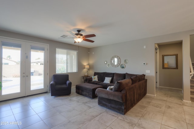 living room with ceiling fan, french doors, and light tile patterned floors