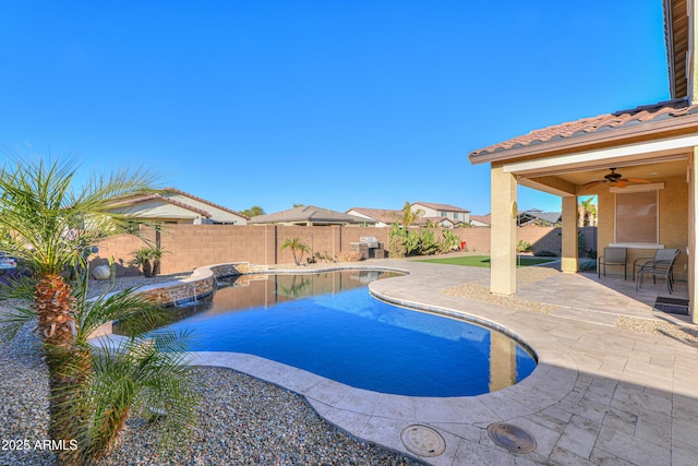 view of pool with ceiling fan and a patio