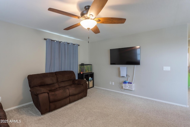 carpeted living room featuring ceiling fan