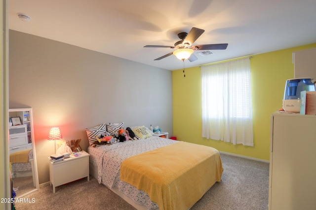 bedroom featuring light colored carpet and ceiling fan