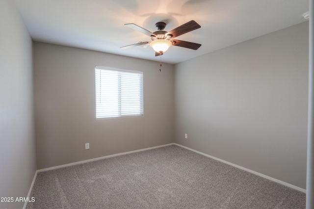 spare room featuring ceiling fan and carpet floors