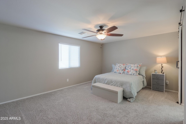 bedroom with ceiling fan and light colored carpet