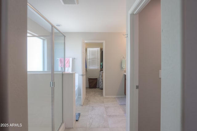 bathroom featuring vanity and a shower with door