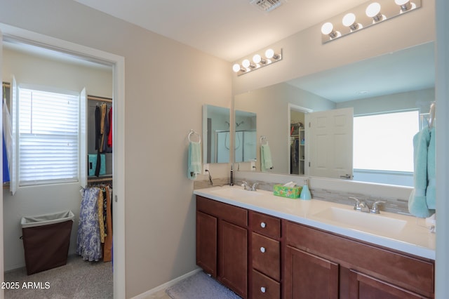 bathroom featuring vanity and a wealth of natural light