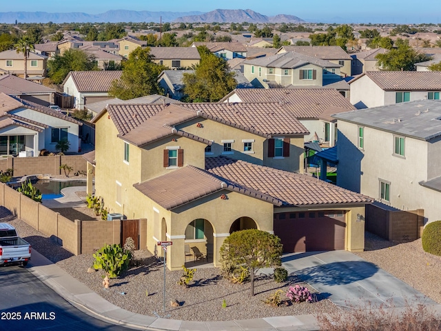 birds eye view of property featuring a mountain view