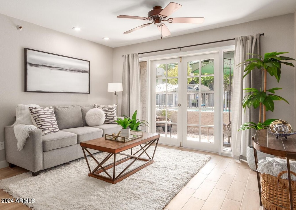 living room with french doors and ceiling fan