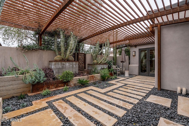 view of patio with a pergola and french doors