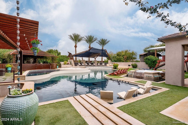 view of swimming pool featuring a patio and an in ground hot tub