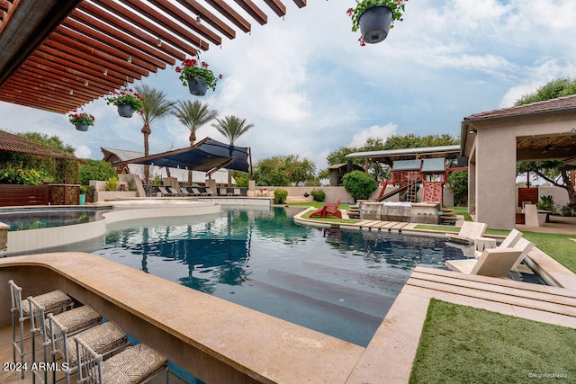 view of swimming pool with a patio, a hot tub, and exterior bar