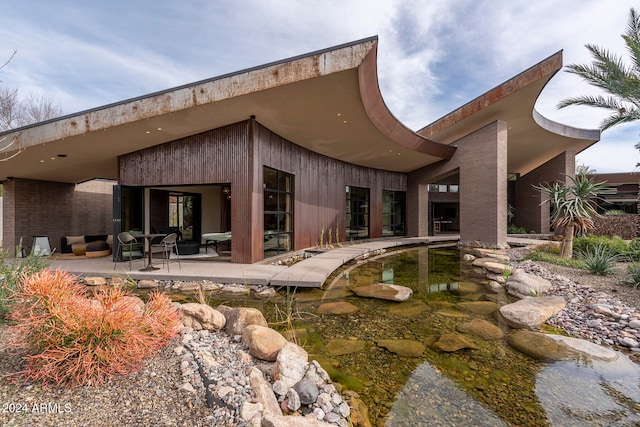 rear view of house with a patio