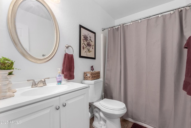 full bathroom featuring tile patterned flooring, vanity, and toilet