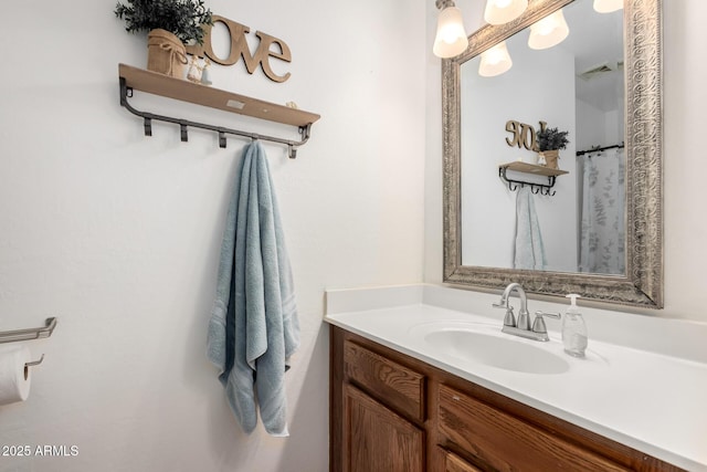 bathroom with visible vents and vanity