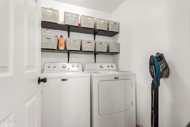 washroom featuring laundry area and washer and dryer