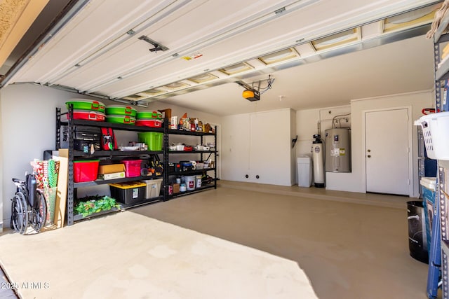 garage featuring a garage door opener and water heater