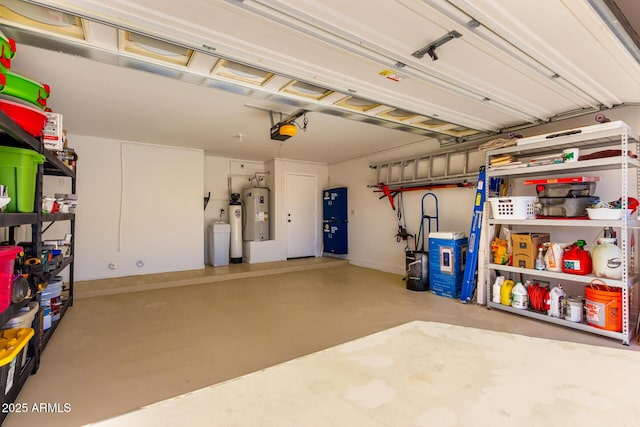 garage featuring water heater and a garage door opener