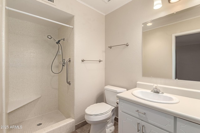 full bathroom with ornamental molding, toilet, tiled shower, and vanity
