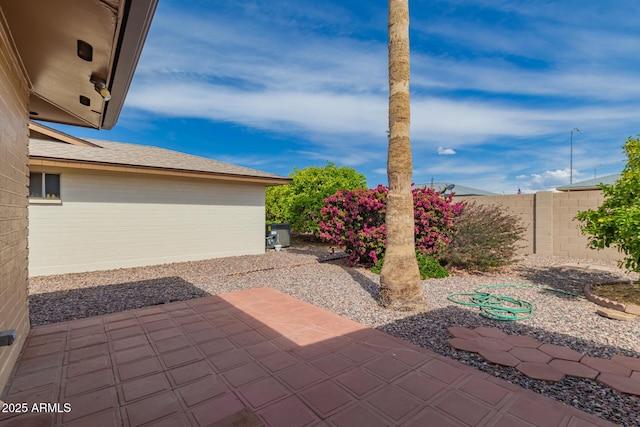 view of patio / terrace featuring fence