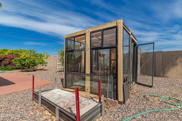 view of outdoor structure with a fenced backyard