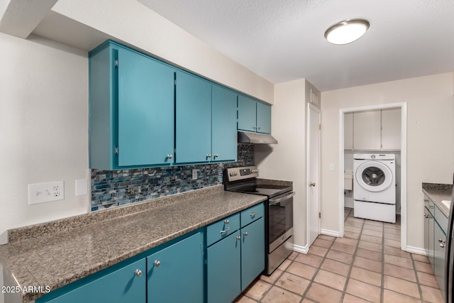 kitchen with tasteful backsplash, washer / clothes dryer, baseboards, under cabinet range hood, and stainless steel range with electric cooktop