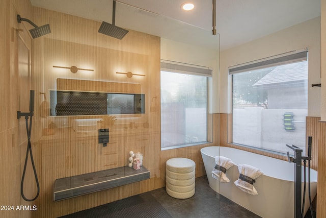 bathroom featuring tile patterned flooring and shower with separate bathtub