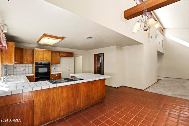 kitchen with kitchen peninsula, decorative backsplash, black appliances, dark colored carpet, and tile counters