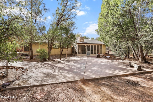 view of patio with a sunroom