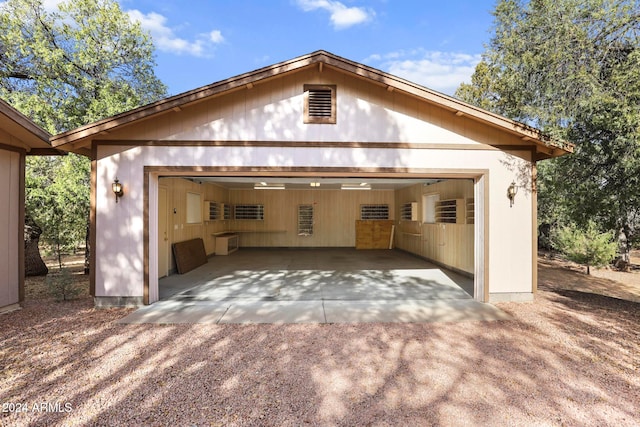 exterior space featuring an outbuilding and a garage