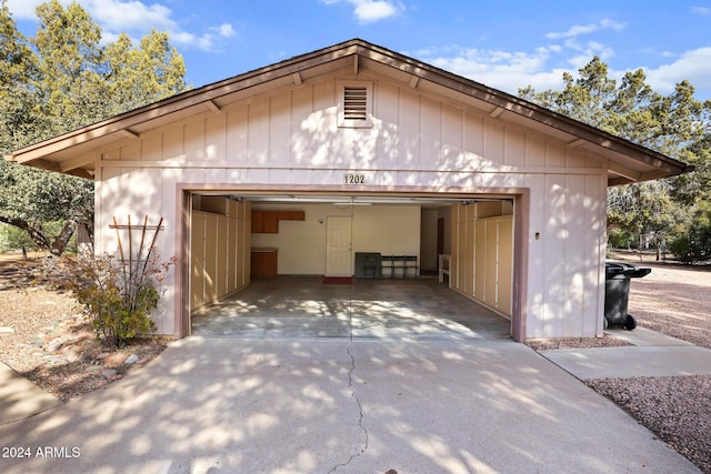 view of home's exterior with an outdoor structure and a garage