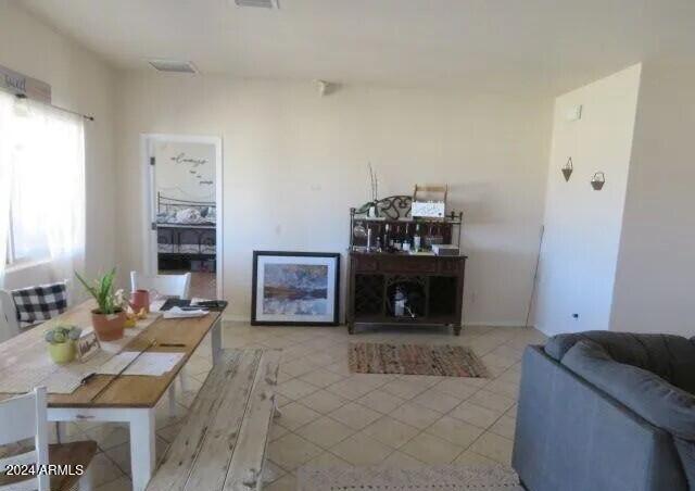 living room with light tile patterned flooring