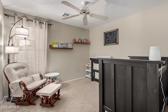 bedroom featuring light colored carpet and ceiling fan