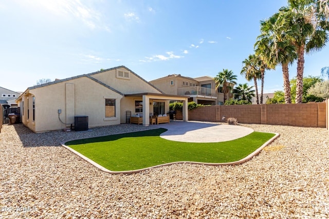 back of property featuring a patio area, central AC unit, and a lawn