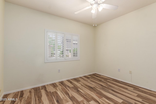 9455 E Raintree Dr Unit 1025, Scottsdale, AZ 85260 - empty room featuring wood finished floors, ceiling fan, and baseboards