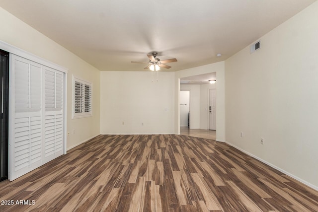 9455 E Raintree Dr Unit 1025, Scottsdale, AZ 85260 - unfurnished bedroom featuring wood finished floors, baseboards, and a ceiling fan
