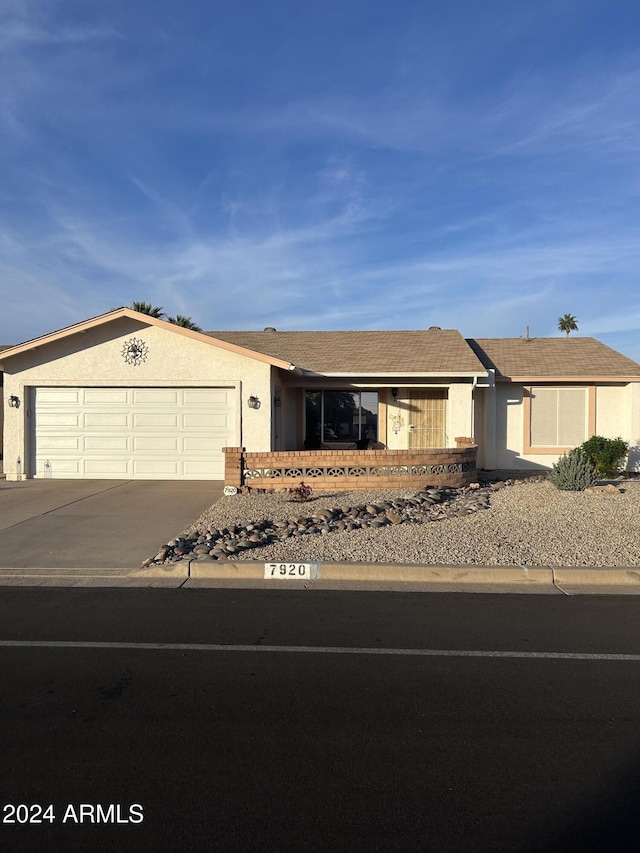 ranch-style house featuring a garage