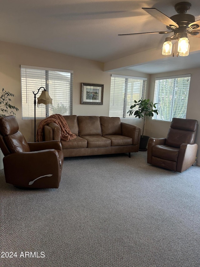 living room featuring carpet flooring and ceiling fan