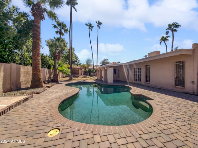 view of swimming pool featuring a patio area