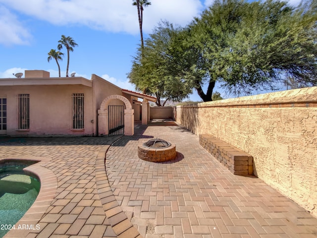 view of patio / terrace featuring a fire pit