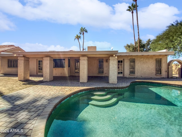 view of swimming pool featuring a patio area