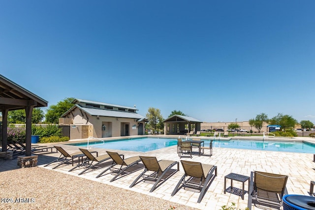 view of swimming pool with a patio area