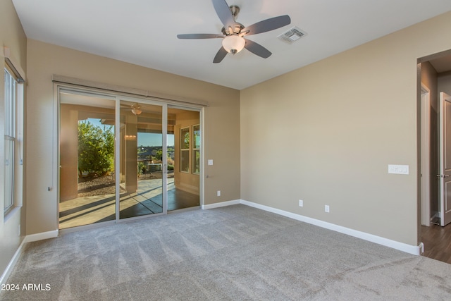 carpeted empty room with ceiling fan