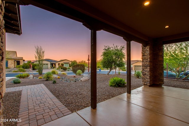 view of patio terrace at dusk